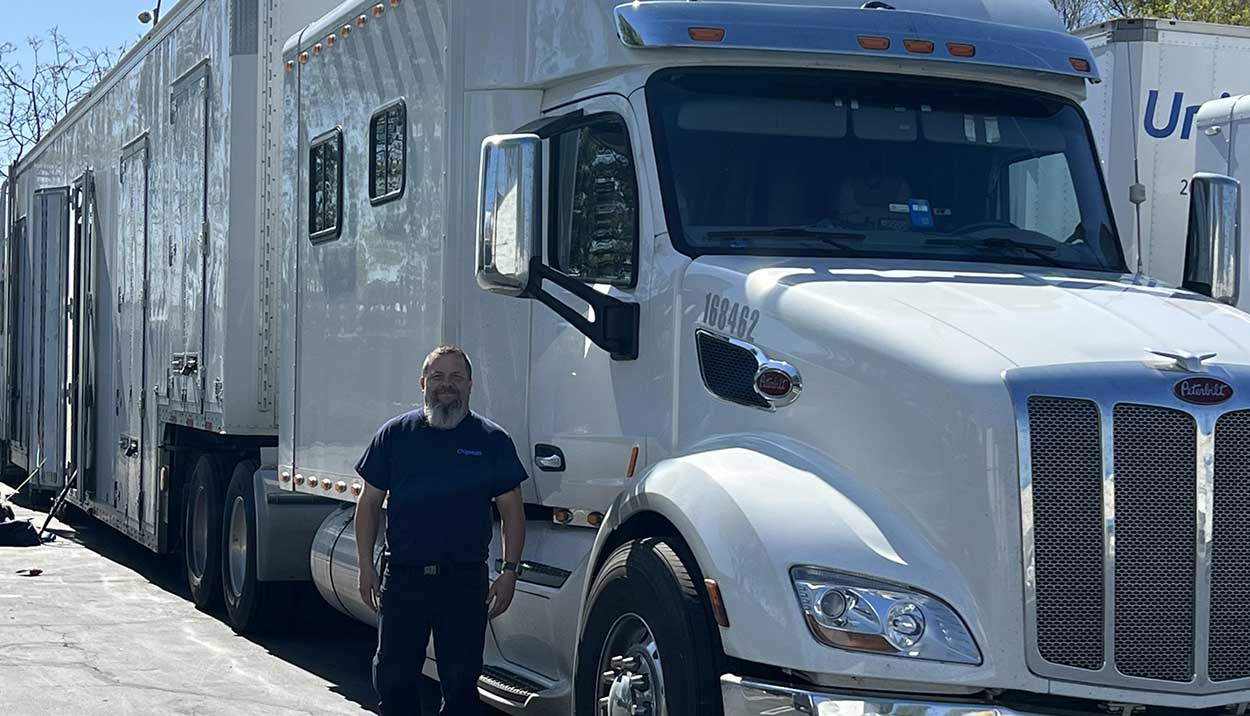 Chipman Relo Driver standing next to truck