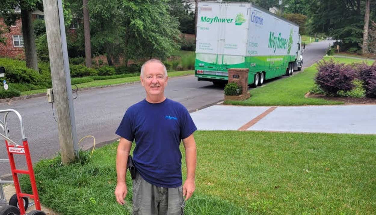 Chipman Relo Driver standing at customer house near truck