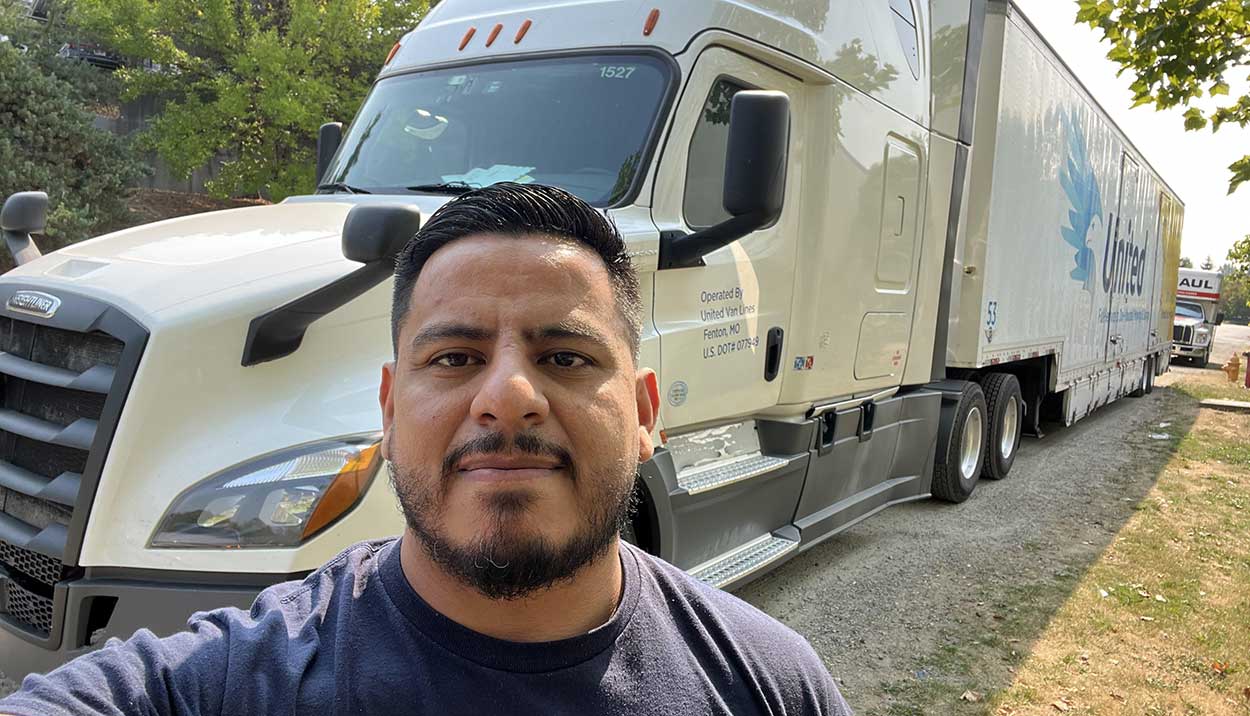 Chipman Relo Driver in front of Chipman United Truck